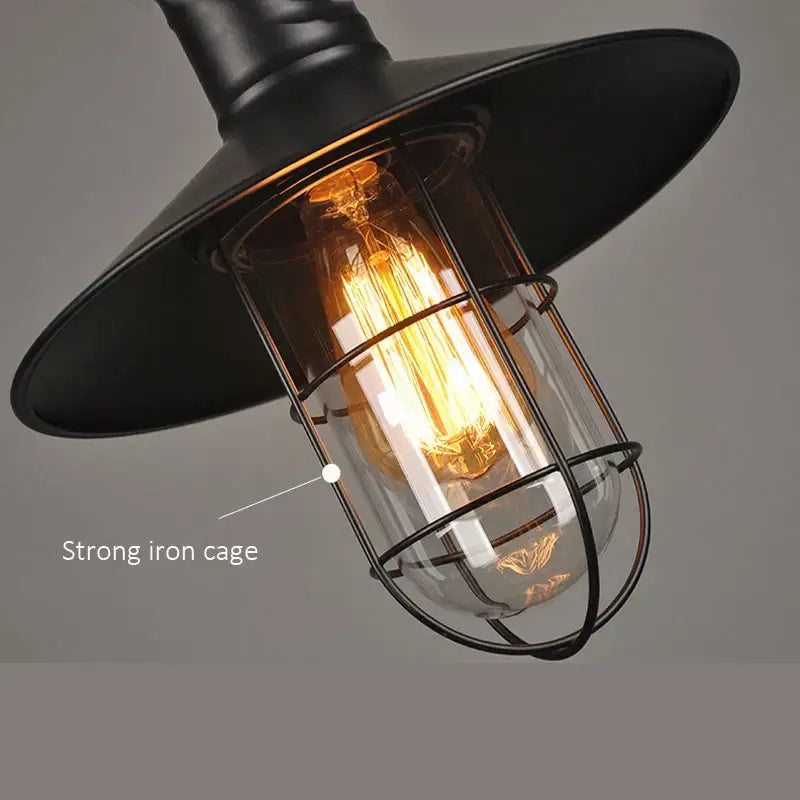 Industrial black bird cage pendant light with wide metal shade iron cage and exposed filament bulb decorbites bird cage