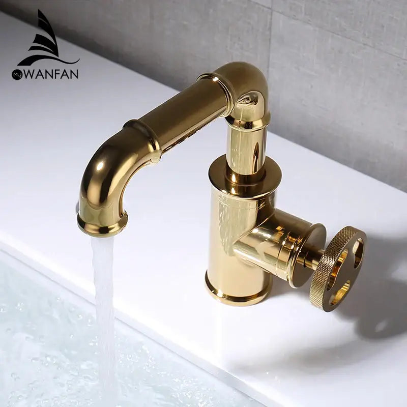 Gold-finished black brass basin faucet with vintage industrial design and textured circular handle for bathroom use