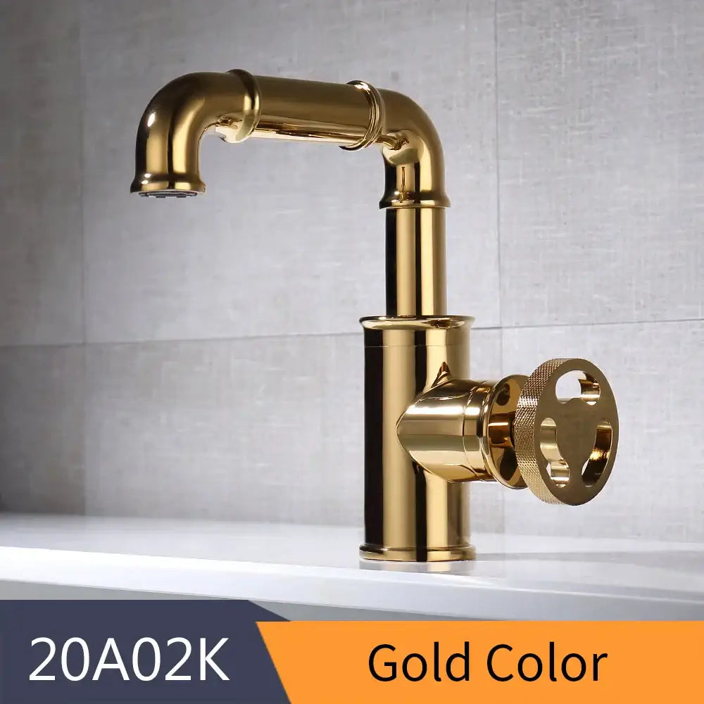 Gold-colored vintage industrial decorbites black brass basin faucet with round textured handle for bathroom use