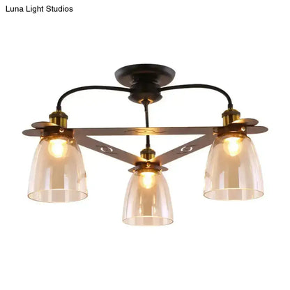 Bronze-finished ceiling lamp with three amber-tinted cognac glass bell shades in triangular frame for living room