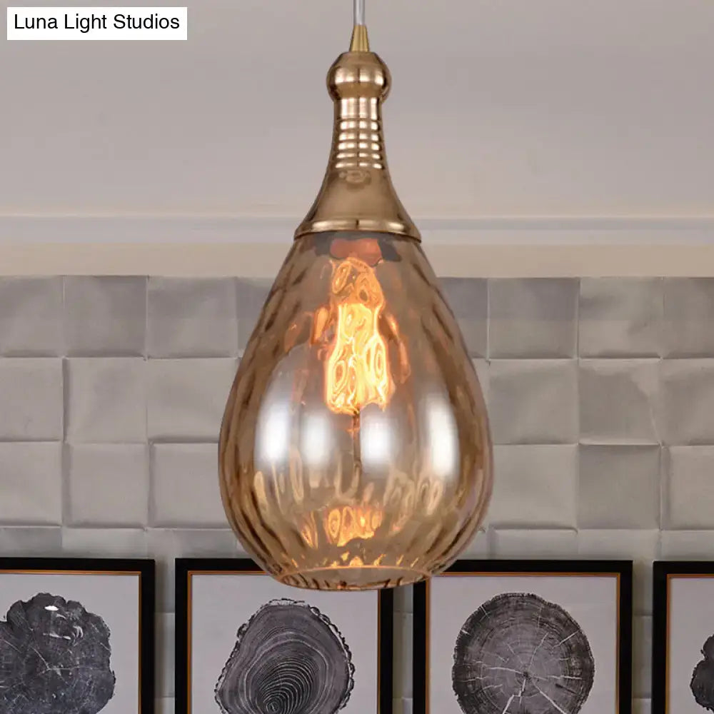 A daisy industrial black brass teardrop ceiling light with amber glass and exposed filament bulb pendant fixture