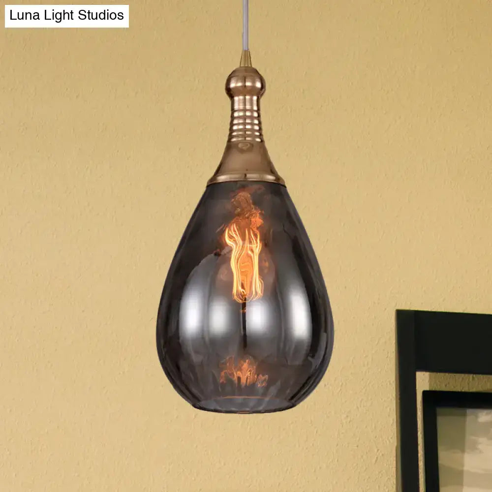 A daisy industrial black ceiling light with dark smoked glass, brass finish, and exposed filament bulb pendant fixture