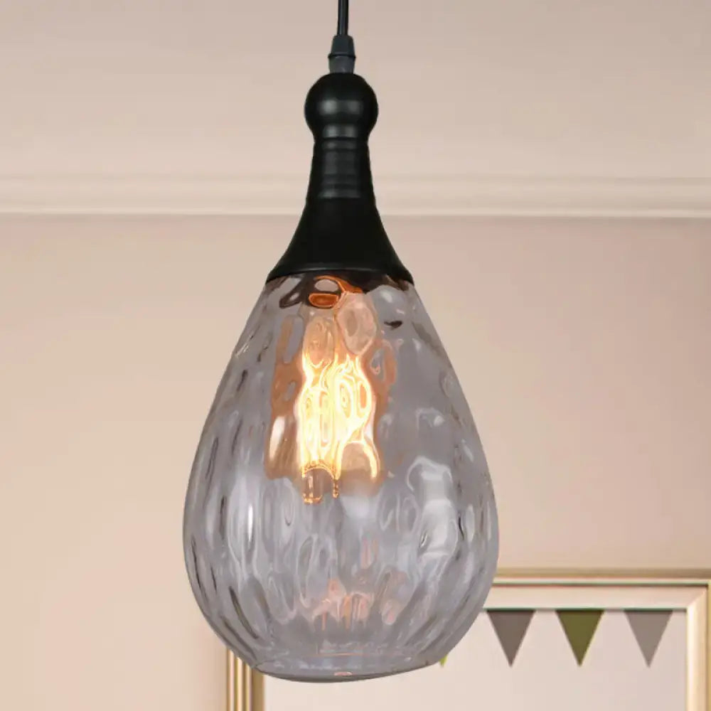 A teardrop-shaped daisy industrial black brass ceiling light with frosted textured glass and exposed edison bulb inside