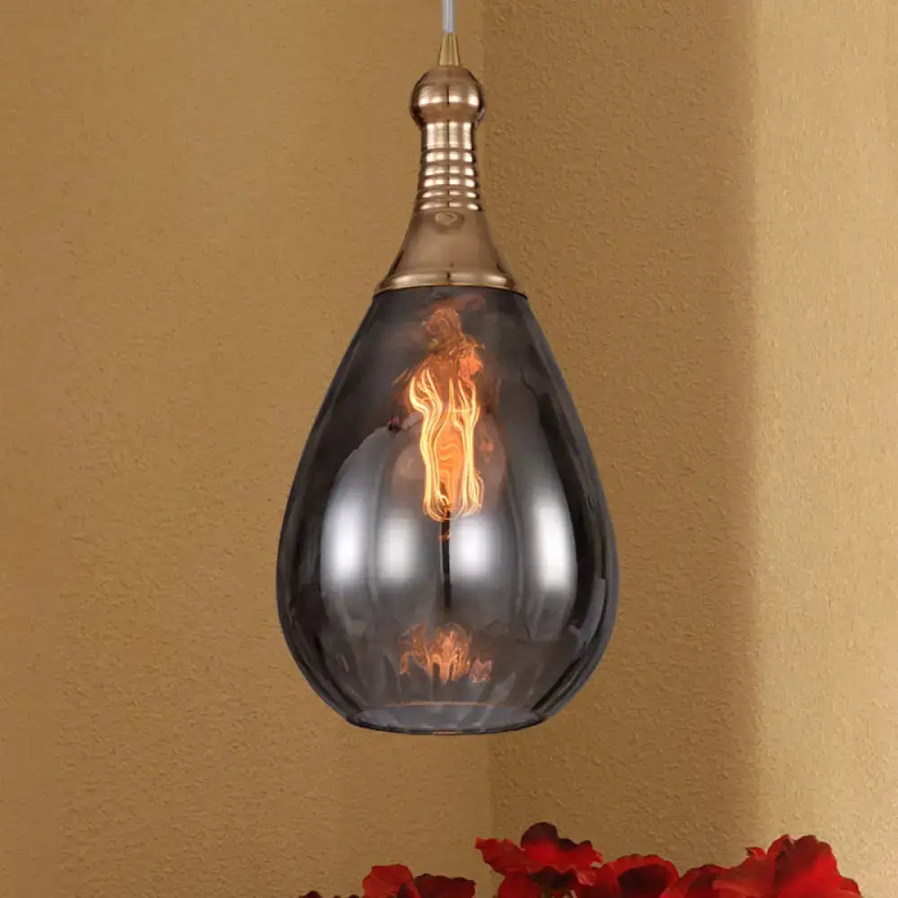 A sleek daisy industrial black ceiling light with smoked glass shade and exposed filament bulb in industrial black brass design