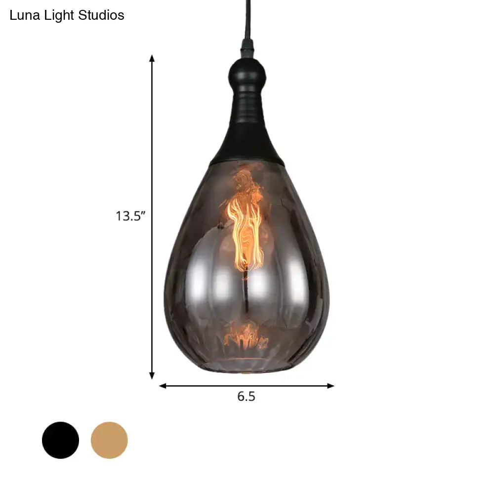 A sleek daisy industrial black brass ceiling light with dark smoked glass shade and black metal fixture pendant design