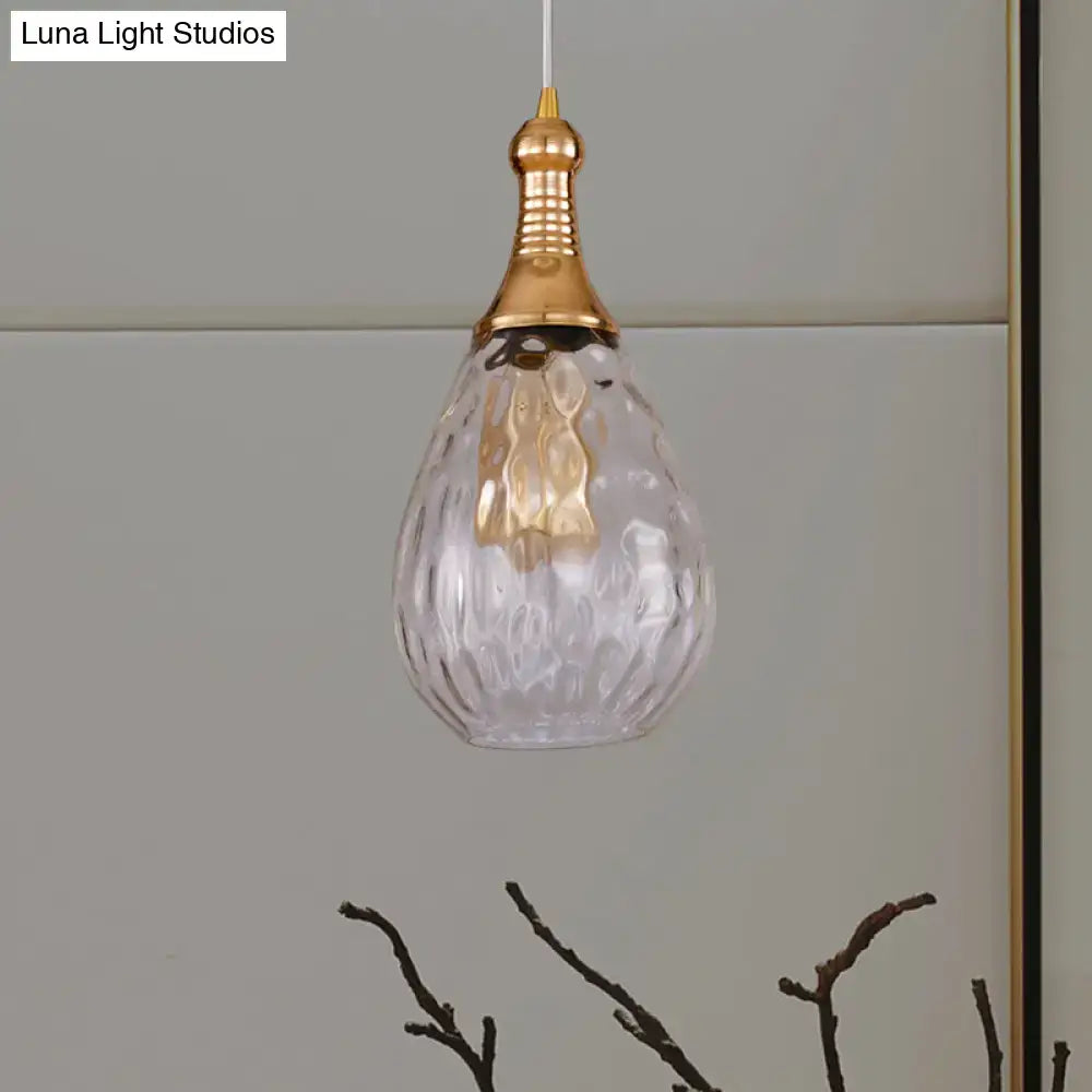 Clear faceted glass pendant ceiling light with gold-toned top hanging chain in daisy industrial black brass style