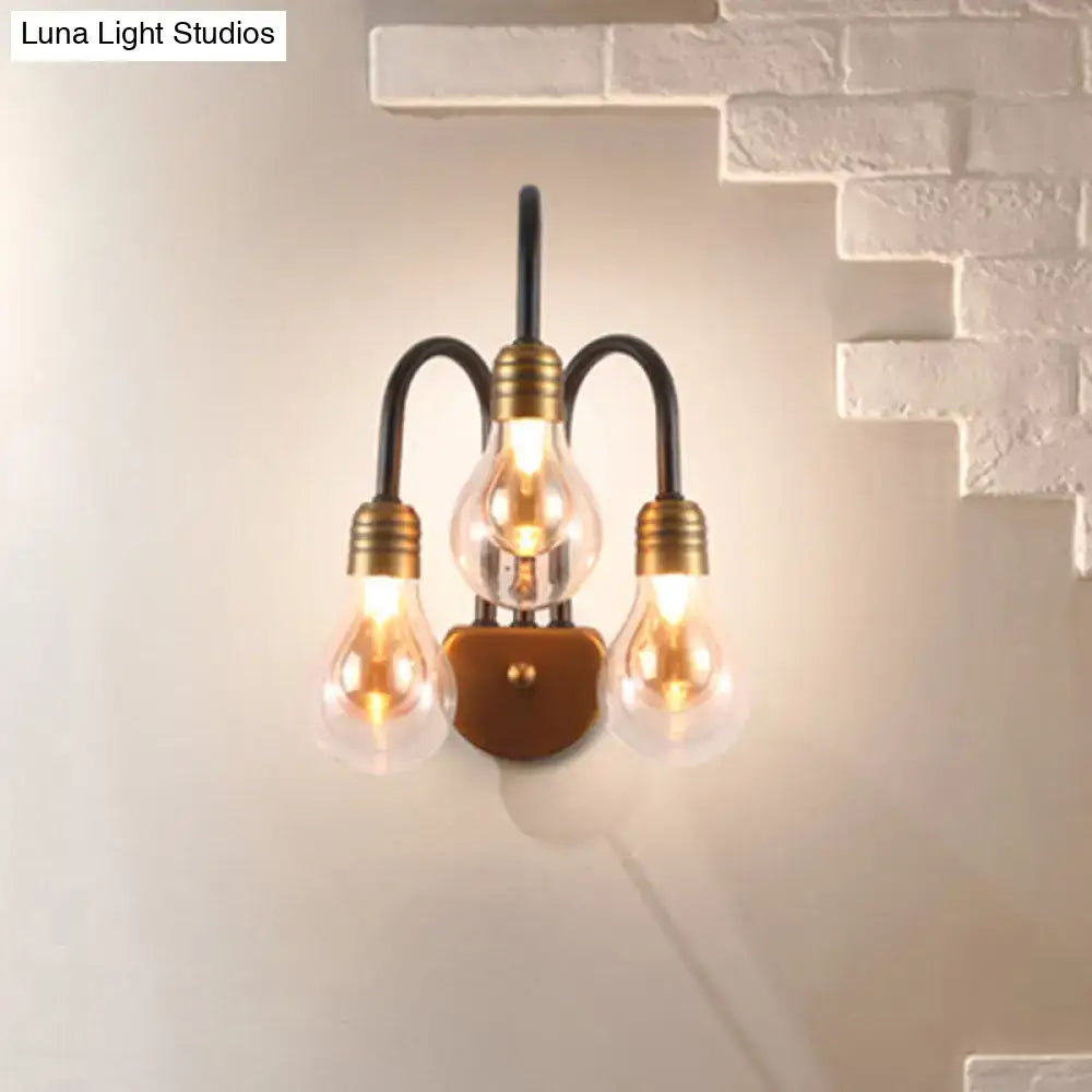 Industrial black and brass wall lamp with three exposed filament bulbs and curved metal arms 220v-240v light type