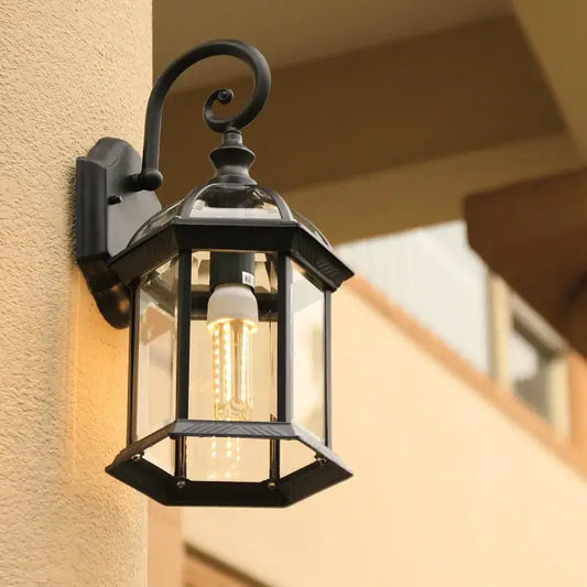 Industrial black bronze wall lamp outdoor lantern in black wrought iron with clear glass and visible LED bulb decorbites black bronze wall