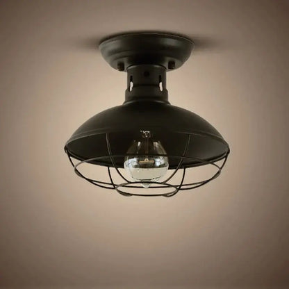 Industrial black cage metal ceiling light with dome-shaped metal shade and clear bulb by decorbites industrial ceiling light