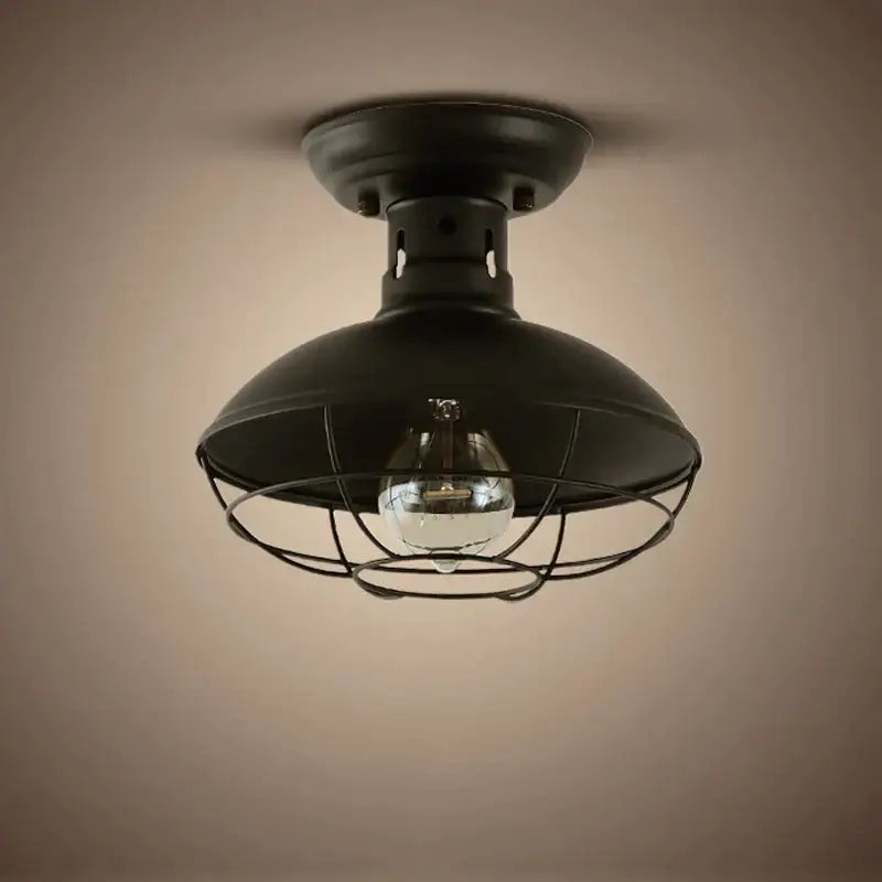 Industrial black cage metal ceiling light with dome-shaped metal shade and clear bulb by decorbites industrial ceiling light