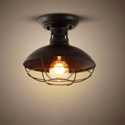 Black industrial ceiling light with dome shade and metal cage housing exposed filament bulb for decorbites industrial ceiling decor