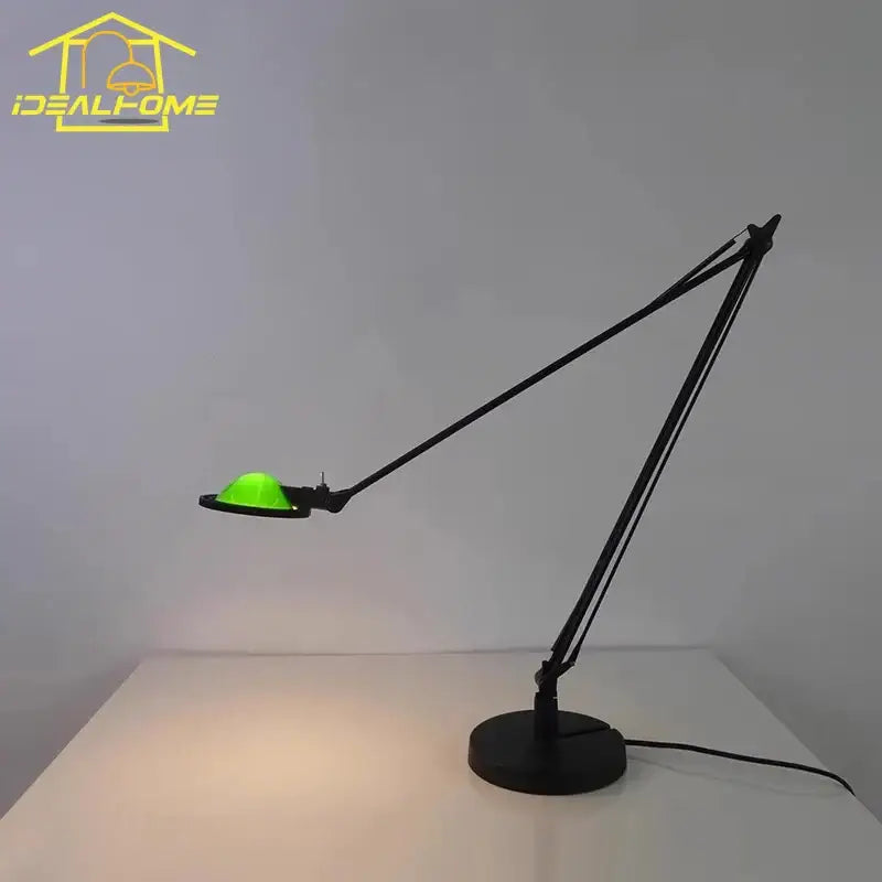 Industrial black and chrome rocker arm desk light with green glowing circular fixture for office task lighting decorbites industrial black desk light
