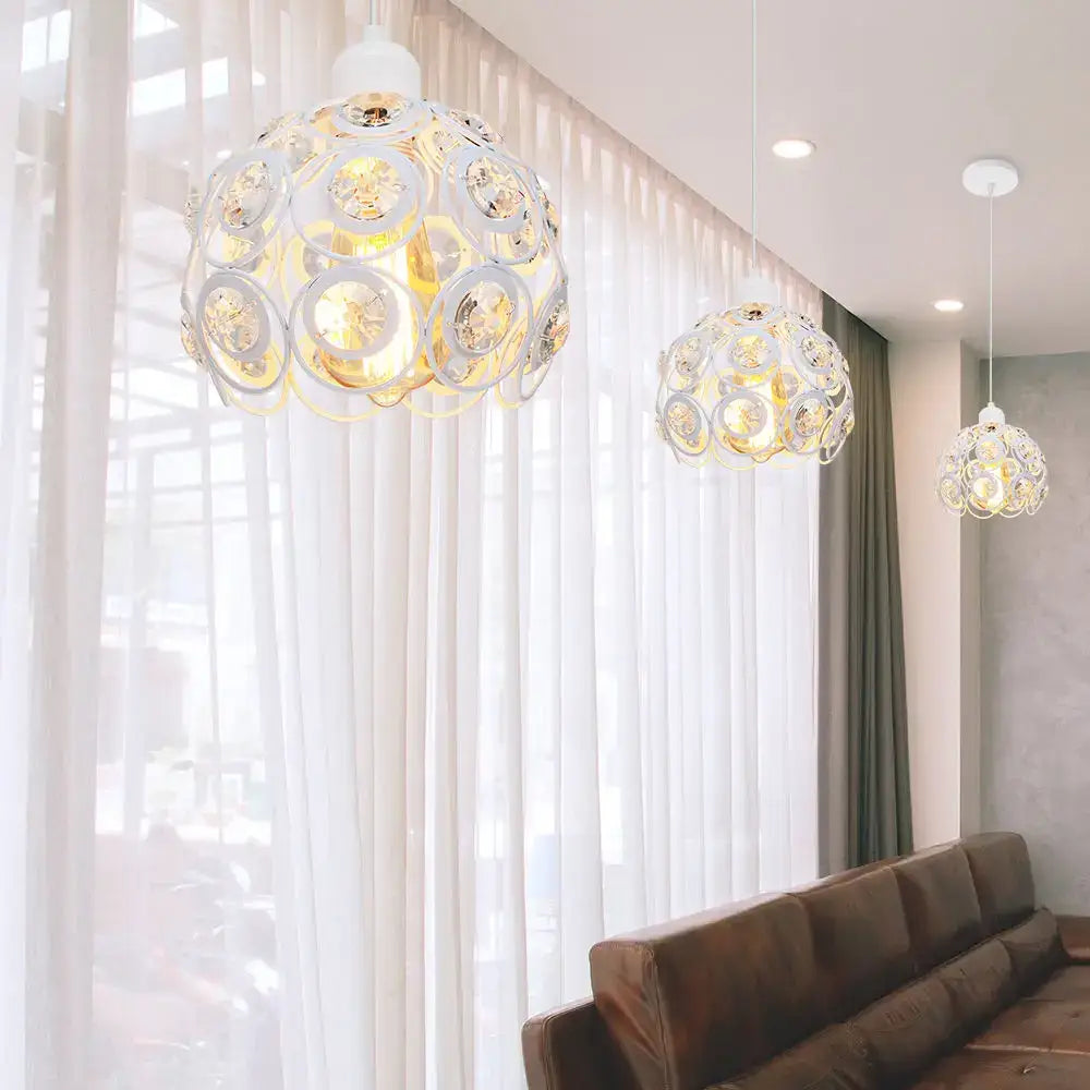 White spherical pendant lamp with intricate circular cutouts and golden accents crystal k9 pendant decorbites crystal