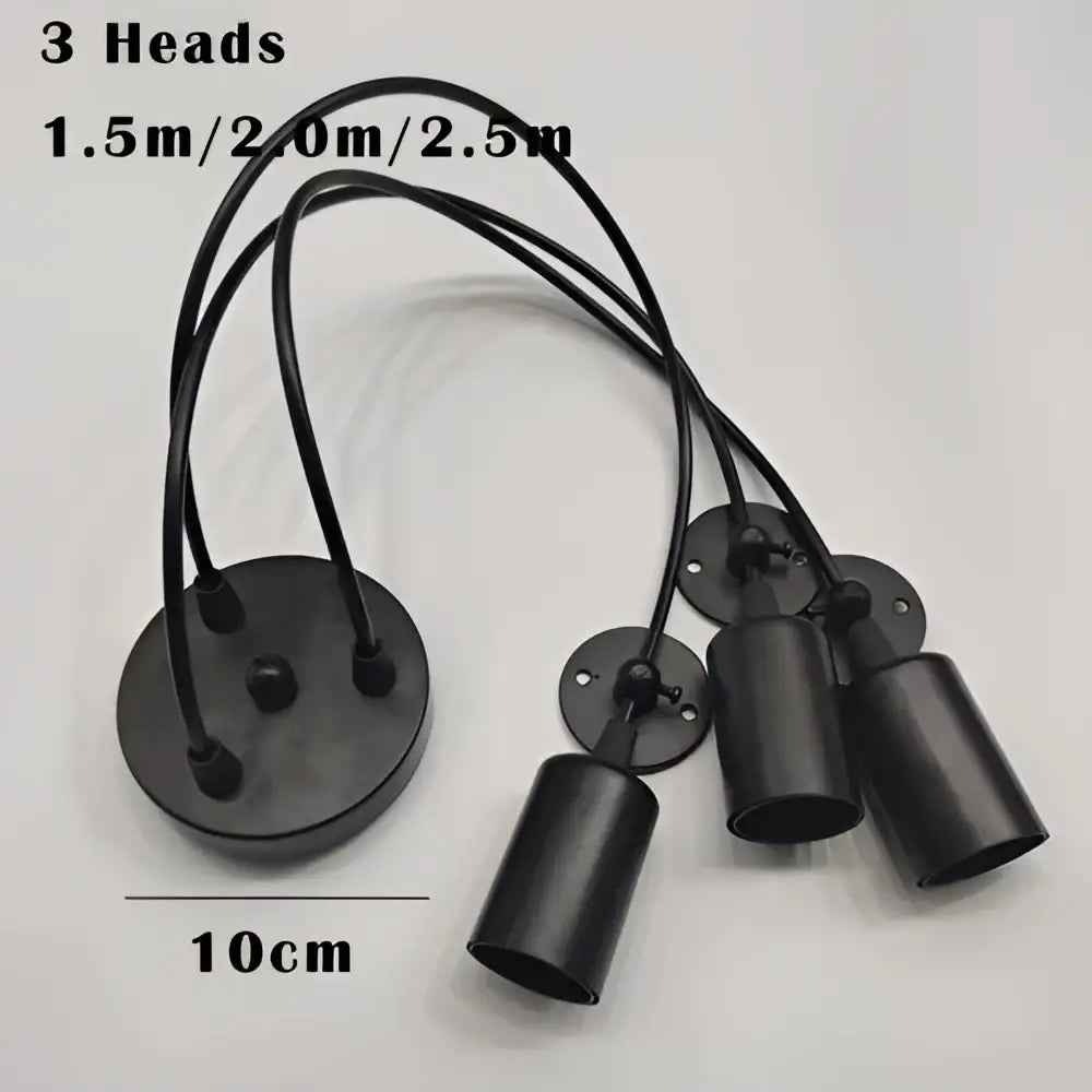 Industrial black finish pendant light with three cylindrical light sources and adjustable cords for dining room use