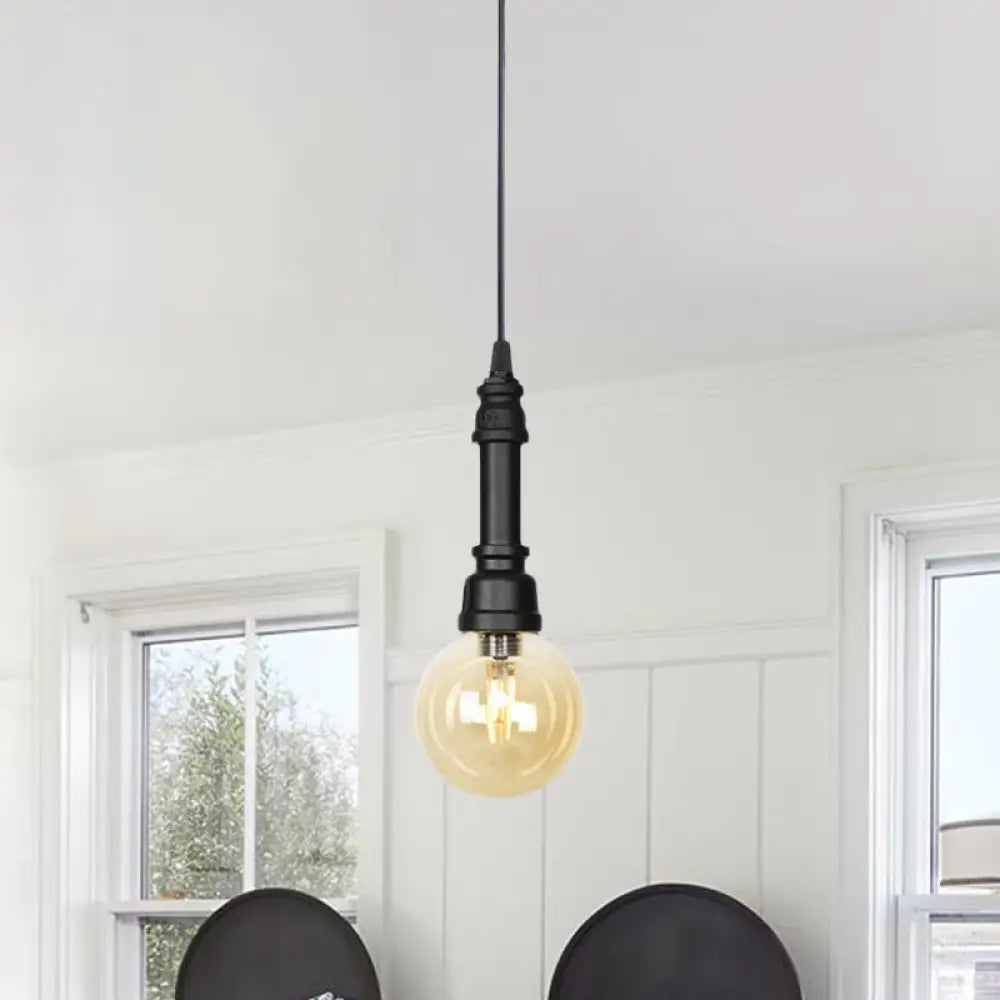 Industrial Black Finish Amber Glass Pendant Lamp with Pipe Suspension - 1-Light Ball/Capsule Ceiling Light