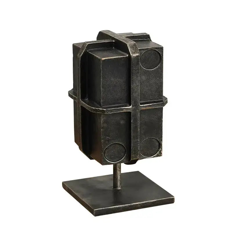 Dark metallic geometric block binding metal bookends with circular cutouts for industrial living room decor