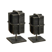 Industrial black geometric block binding metal bookends with rugged textured finish and circular cutouts for living room use