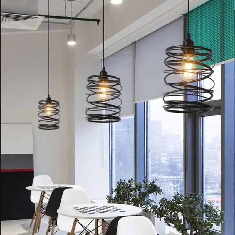 Black spiral metal pendant light with exposed filament bulbs in industrial decorbites cage light frame for dining room