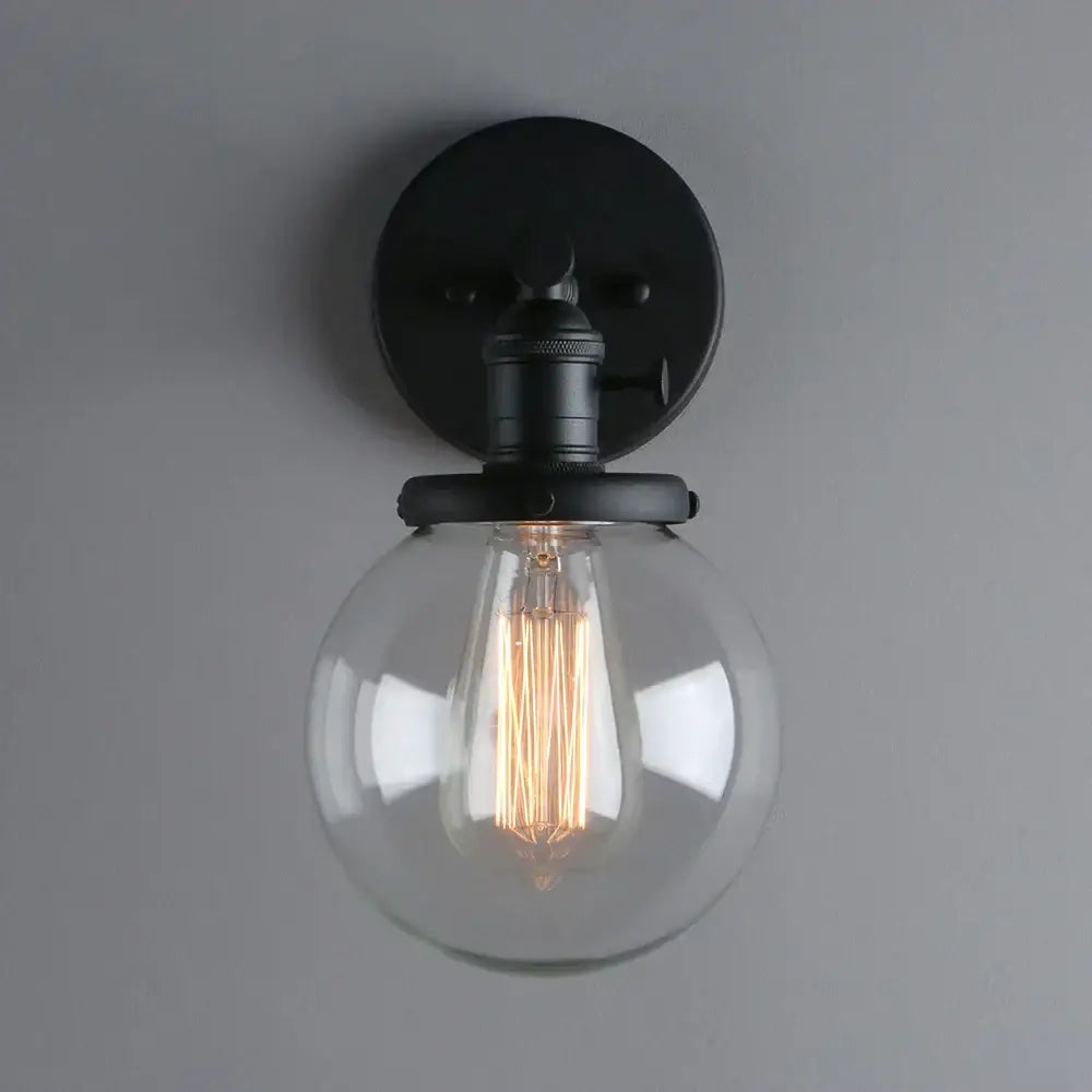 Industrial black glass canopy wall sconce with clear glass globe and exposed filament bulb for kitchen decorbites industrial glass