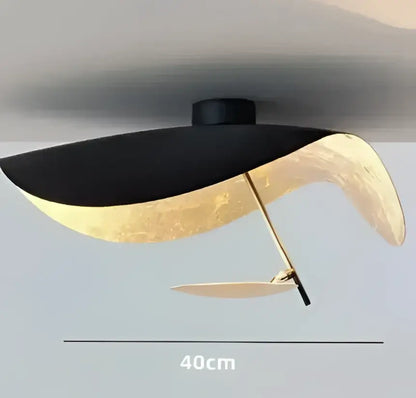 Industrial black and gold lotus leaf pendant light with sleek modern design suitable for dining room decorbites lederam manta