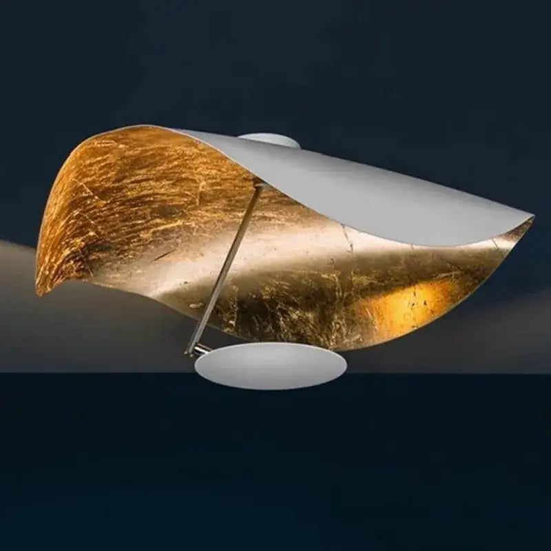 Industrial black and gold lotus leaf pendant light with gold-leafed and white metal wave design decorbites lederam manta