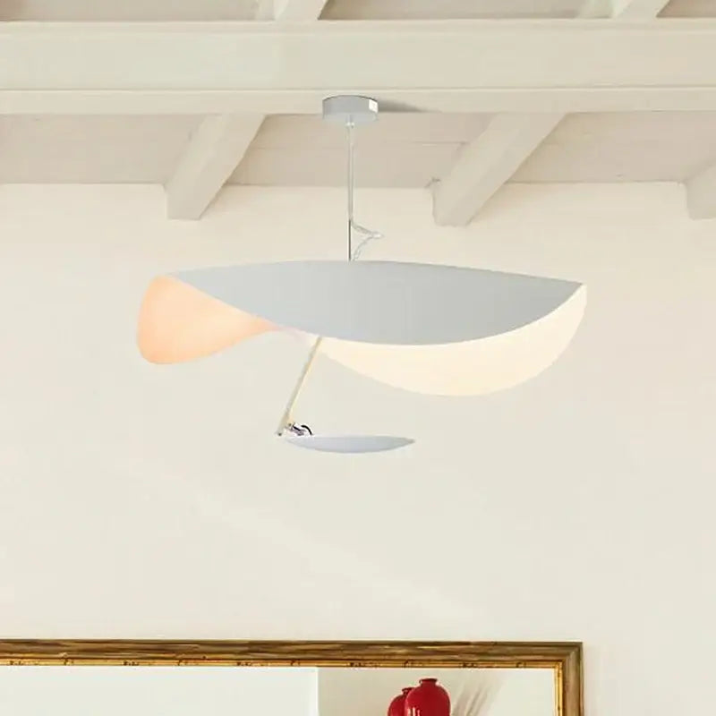 Industrial black and gold lotus leaf pendant light featuring sleek asymmetrical white and peach diffusers by decorbites lederam manta