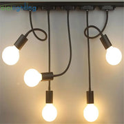 Industrial black gooseneck track lighting fixture with five exposed bulbs and flexible arms for clothing store decorbites industrial gooseneck track