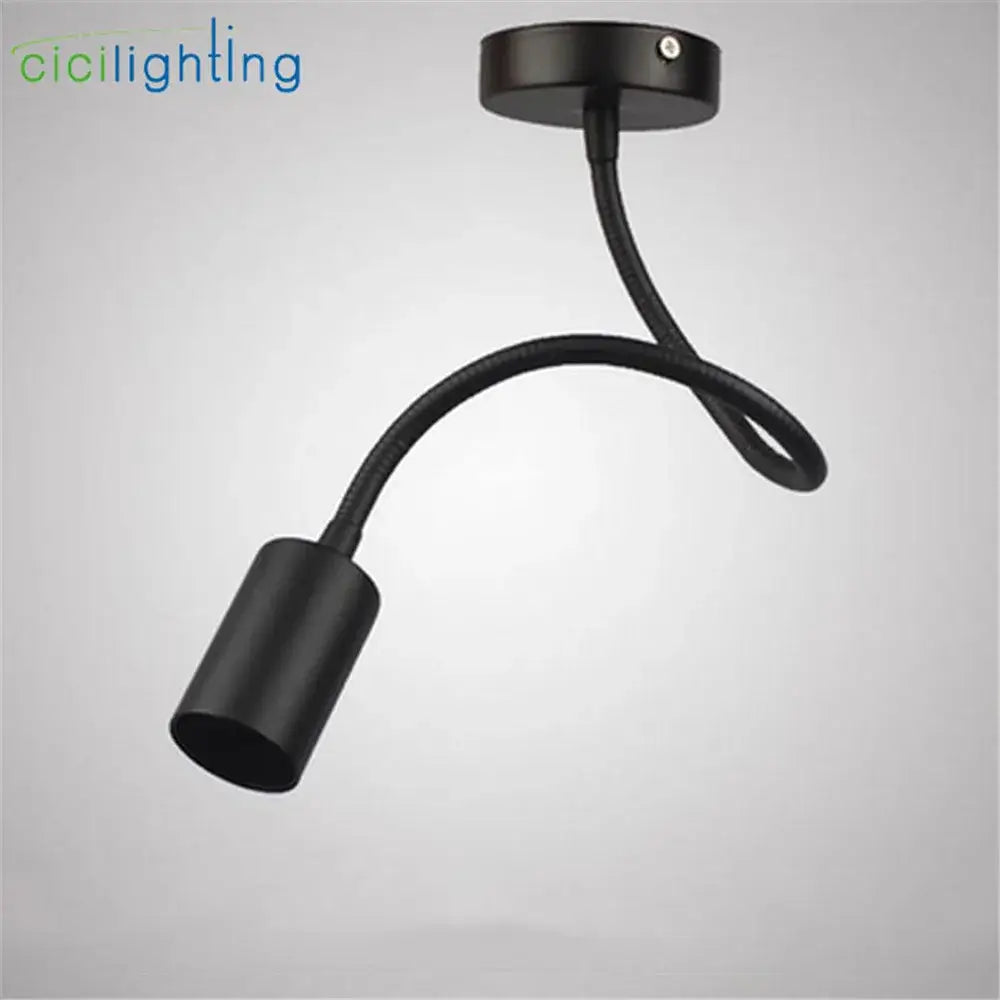 Black flexible industrial gooseneck track lighting with matte finish and cylindrical lamp head for clothing store decorbites industrial gooseneck