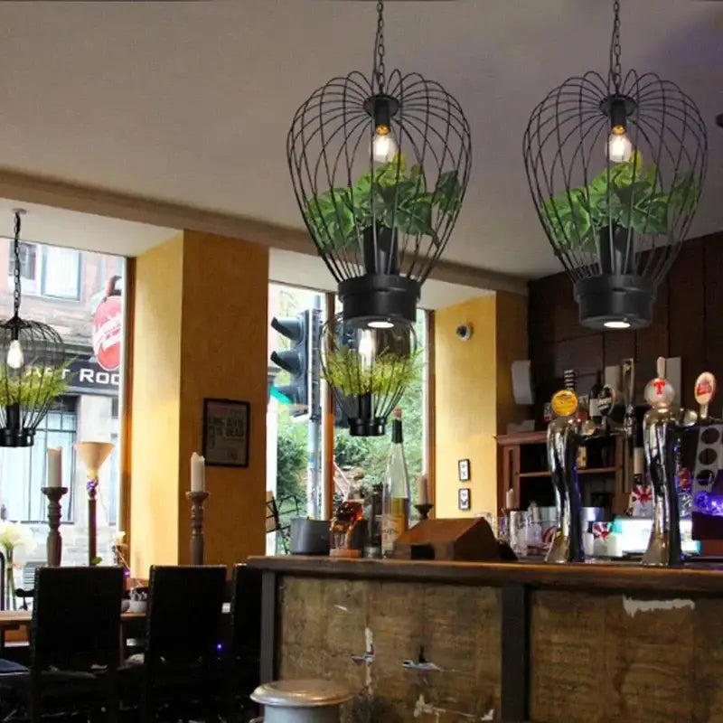 Industrial black green planting birdcage chandelier with wrought iron frame and hanging plants for dining room decorbites green planting