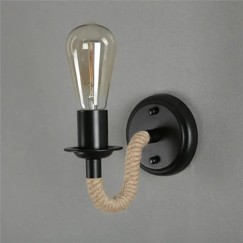Black metal wall lamp with beige decorbites hemp rope arm and exposed filament bulb for industrial living room sconce