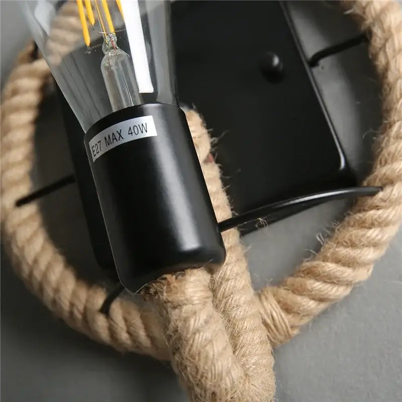 Industrial black hemp rope wall lamp with clear glass bulb housing and visible filament for living room decorbites hemp rope wall