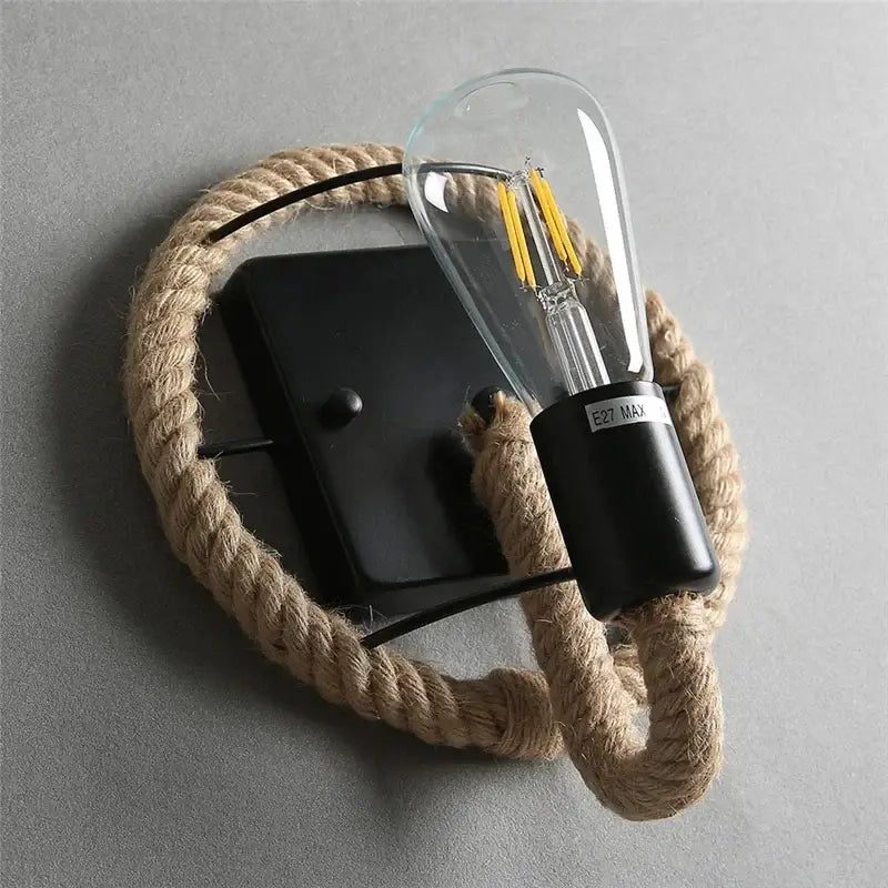 Industrial black hemp rope wall lamp featuring a clear glass filament bulb for stylish living room decorbites hemp rope wall accent