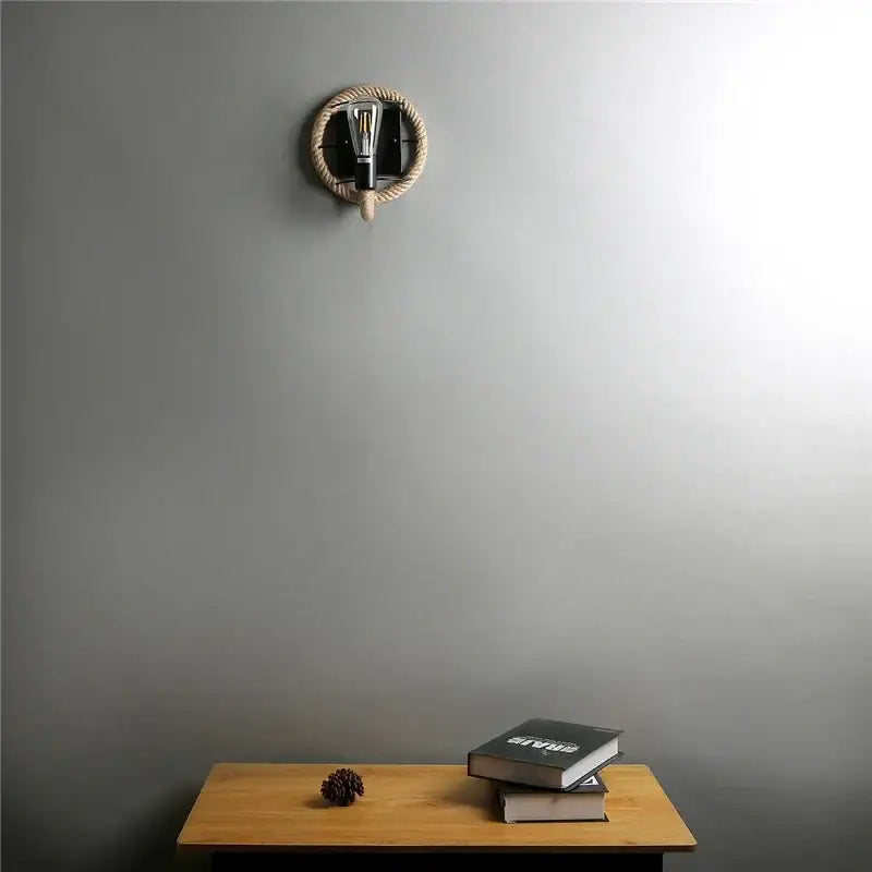 Industrial black hemp rope wall lamp with a black metal base and exposed filament bulb for living room decorbites hemp rope wall sconce