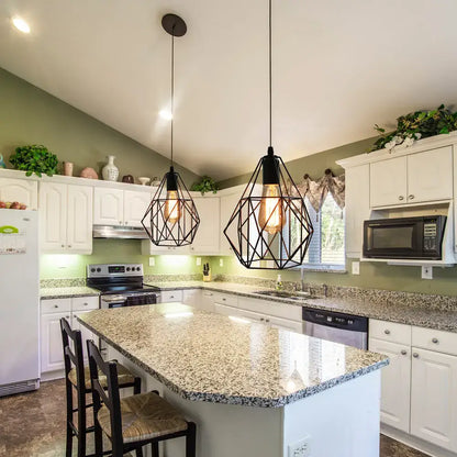 Two black iron cage chandelier pendant lights hang above kitchen island as industrial decorbites ceiling light