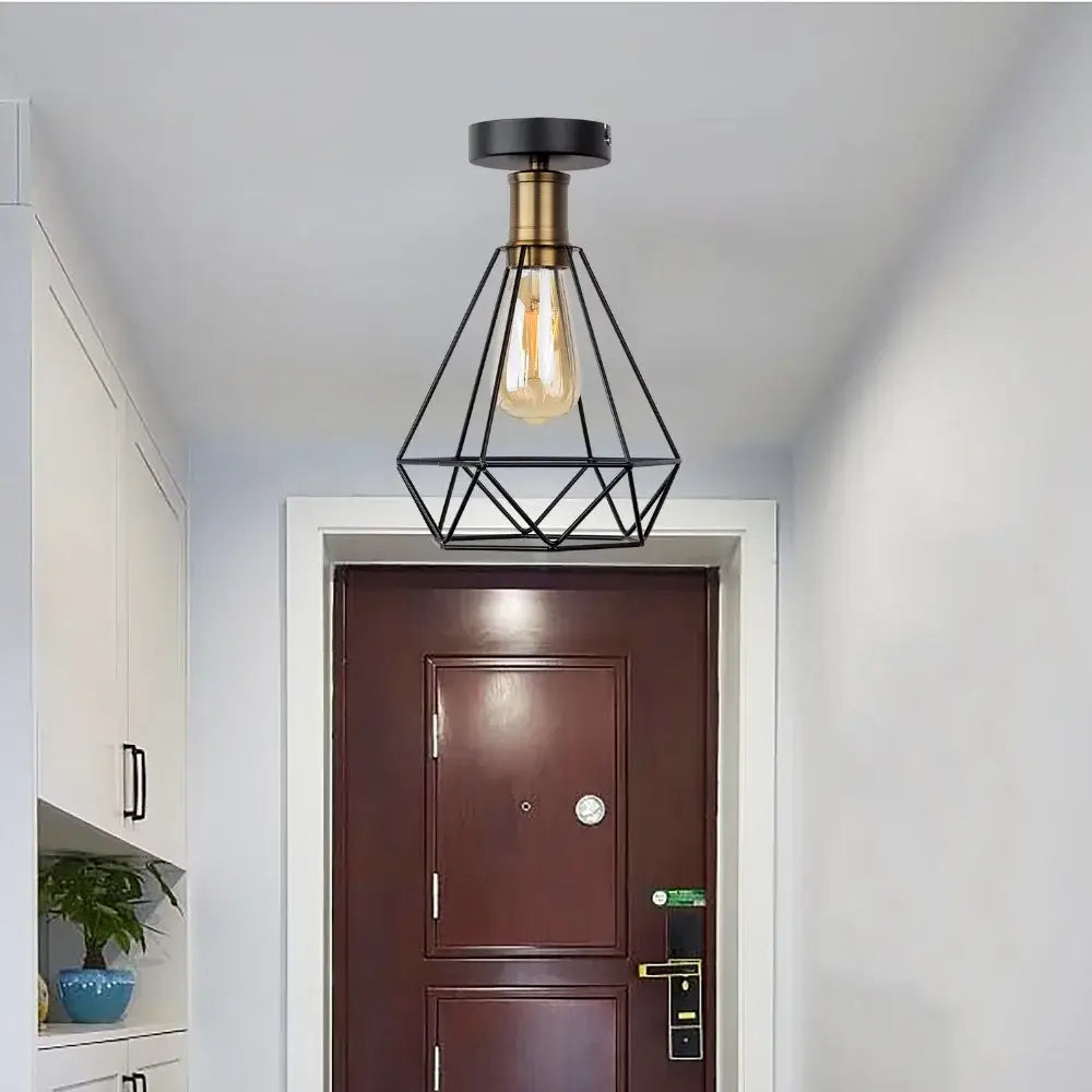 Black geometric metal pendant ceiling light with brass base and exposed edison bulb decorbites iron cage led fixture