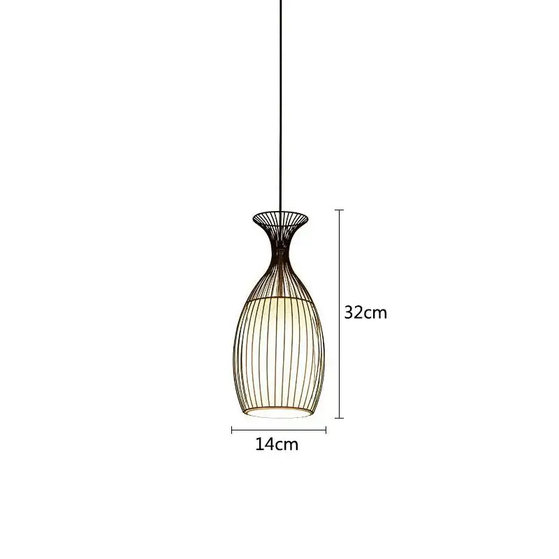 A sleek black iron cage pendant light with vase shape vertical ridges illuminated for dining room decorbites iron cage