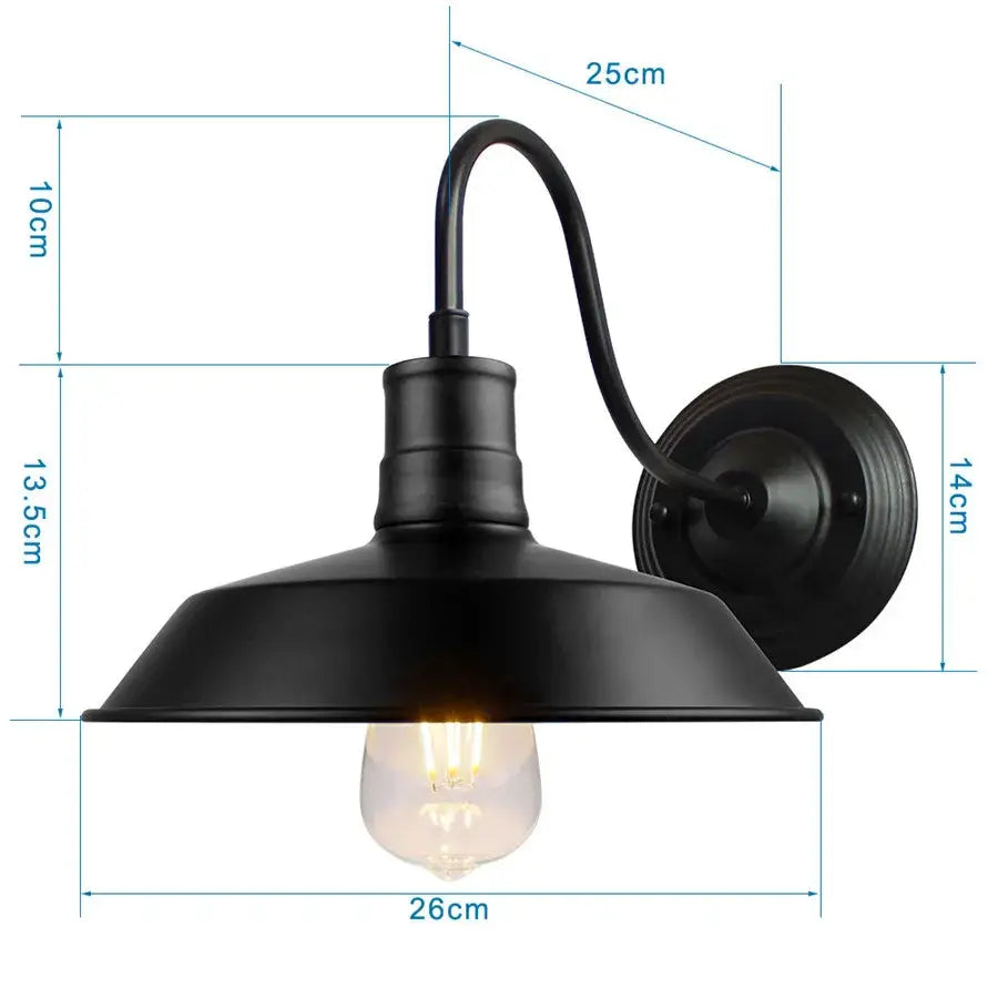 Black wrought iron cage wall sconce with matte finish and exposed edison bulb for industrial bedroom decorbites iron cage