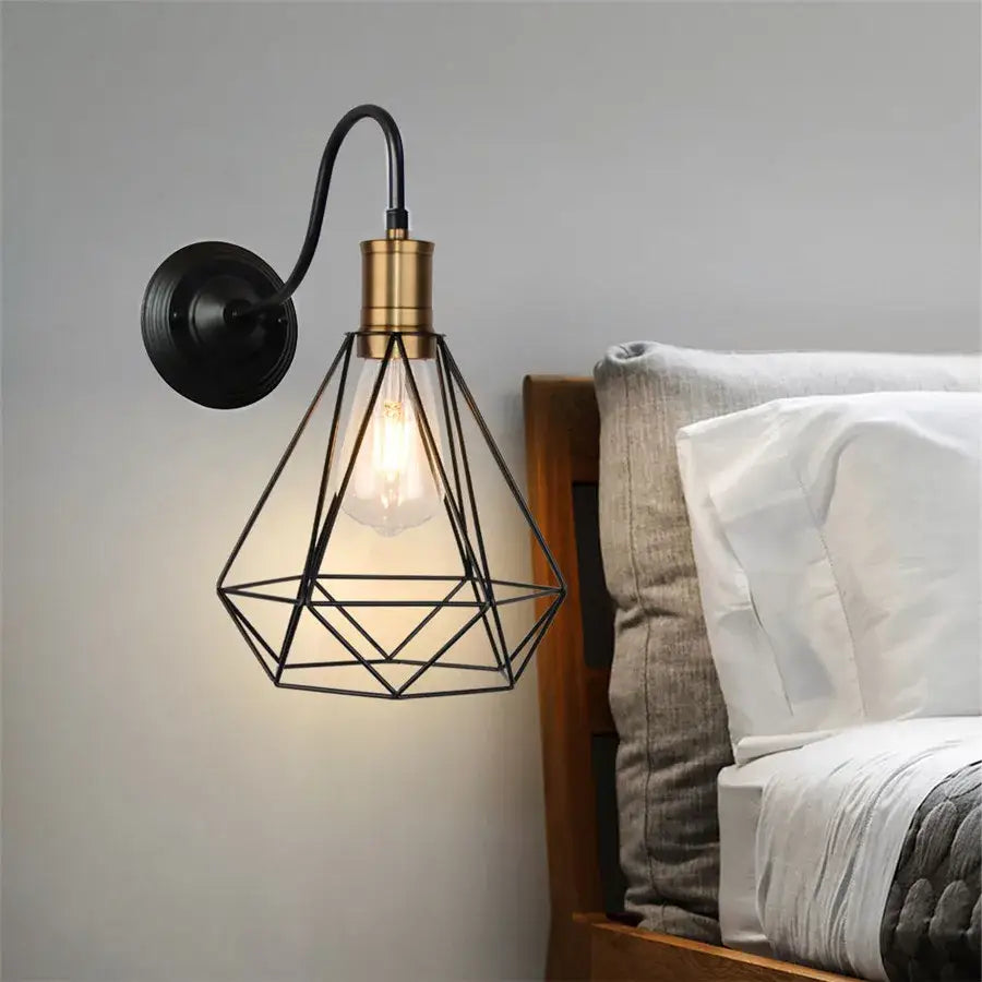 Industrial black iron cage wall sconce with brass accents and geometric design for bedroom decorbites iron cage wall lighting