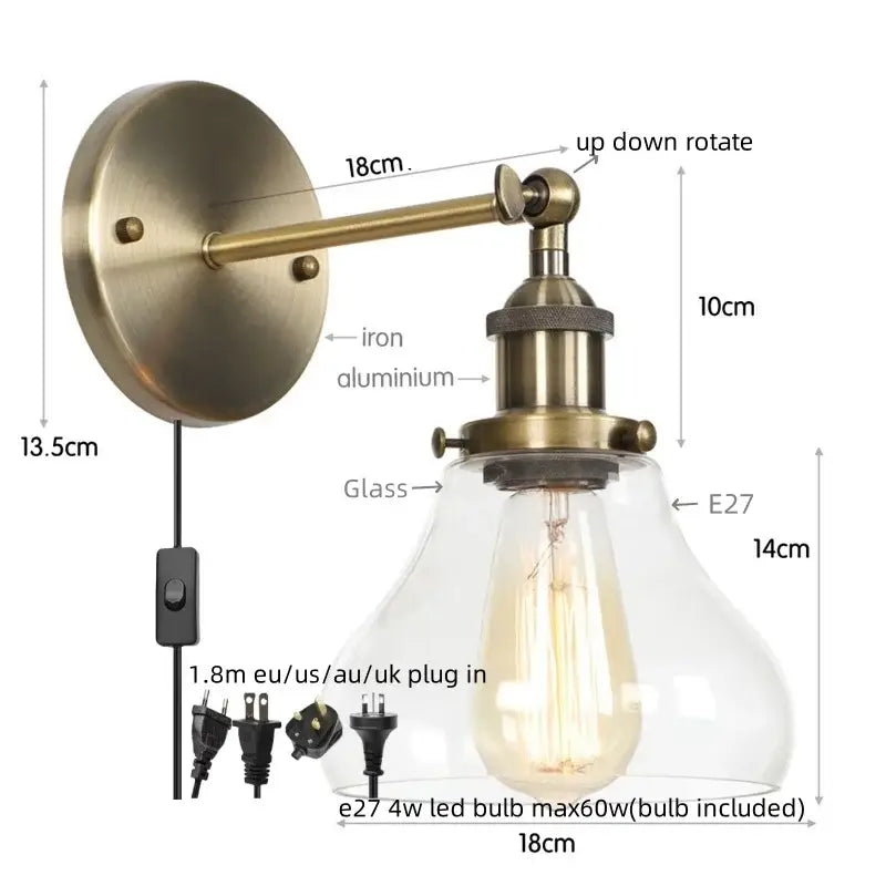 Industrial black iron led wall sconce with antique brass finish clear glass shade and exposed edison-style bulb decorbites black iron