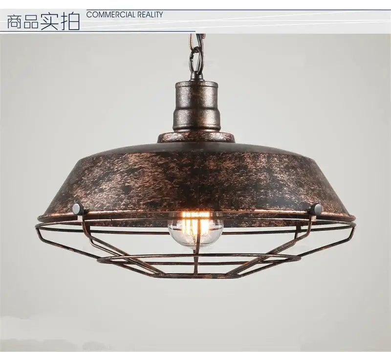 Industrial black iron pendant lights with distressed bronze finish feature a domed wire cage shade for dining room decorbites iron pendant