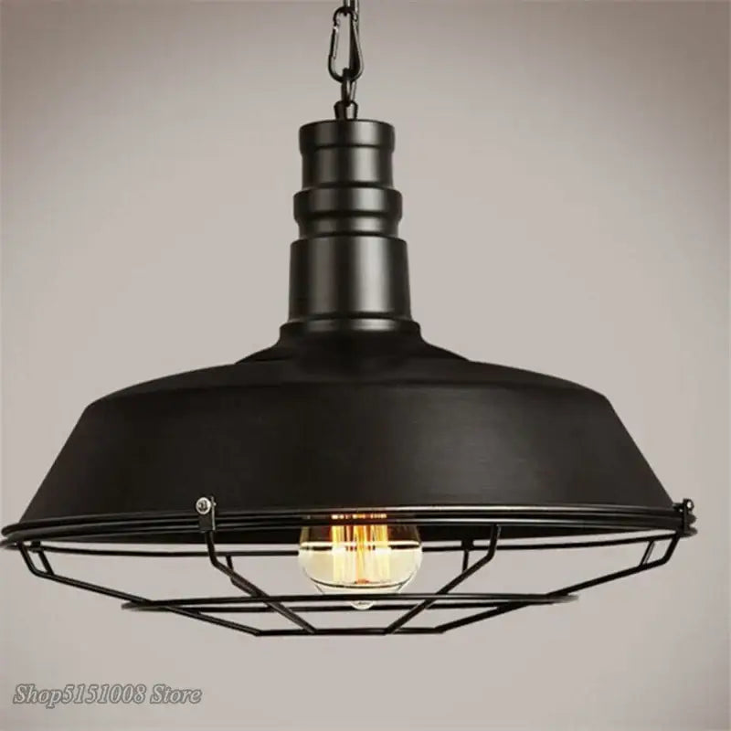 Black industrial iron pendant light with matte dome and wire cage housing exposed bulb for dining room decorbites iron pendant lights