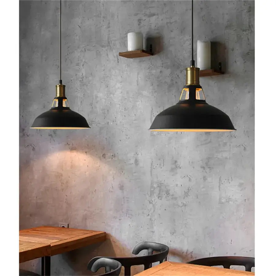 Industrial black iron pendant lights with brass accents hang from ceiling for kitchen Edison bulb decorbites industrial iron pendant