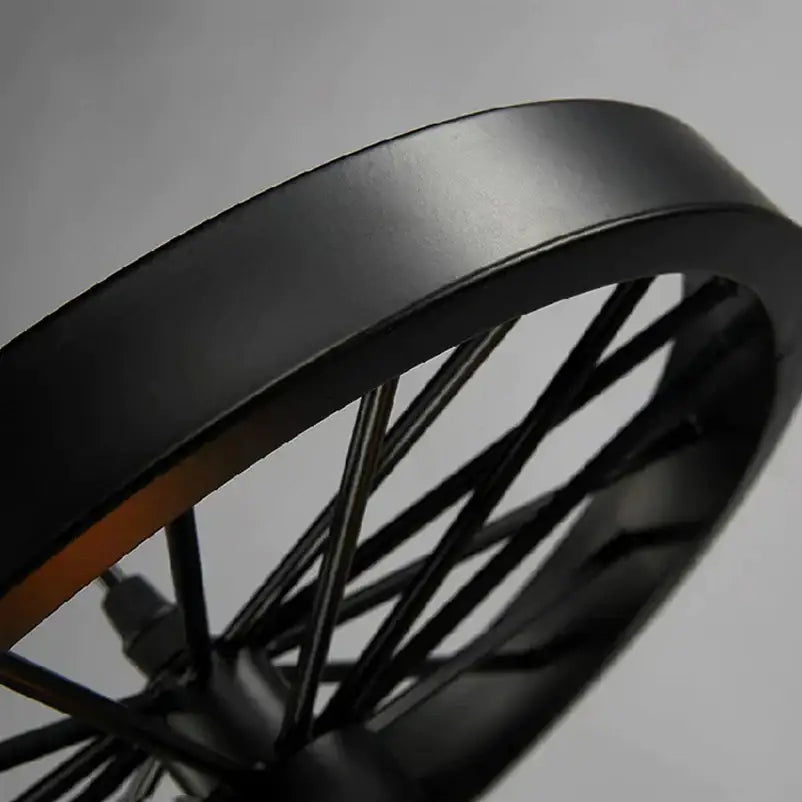 Industrial black iron wheel chandelier pendant light featuring a black matte iron wheel with a modern decorbites design