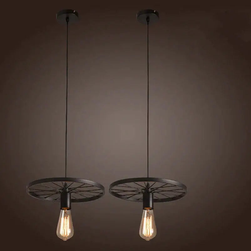 Two black industrial iron wheel chandelier pendant lights with vintage edison bulbs for dining room decorbites iron wheel