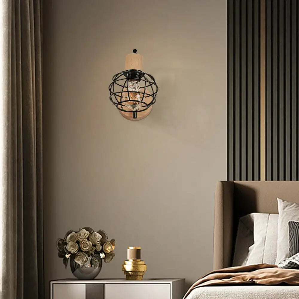 Industrial black iron wood wall lamp with black metal cage and exposed bulb mounted on light wood base for bedroom decorbites iron wood wall
