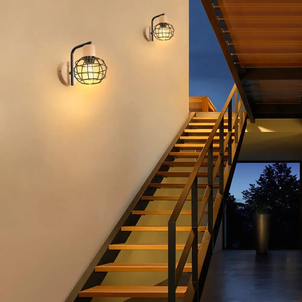 Industrial black iron wood wall lamp with cage-style design and warm glow for bedroom decorbites iron wood wall sconce