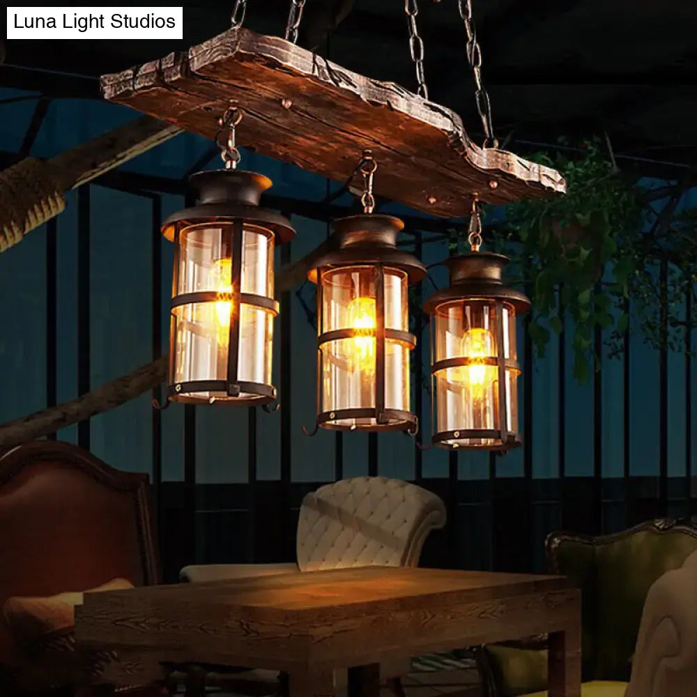 Decorbites industrial pendant light with three vintage lanterns clear glass dark metal frame and rustic wood plank