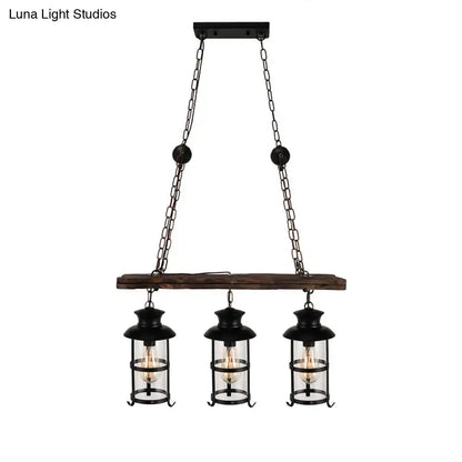 DecorBites industrial black wrought iron pendant light with clear glass bulbs and wood decoration hanging from beam