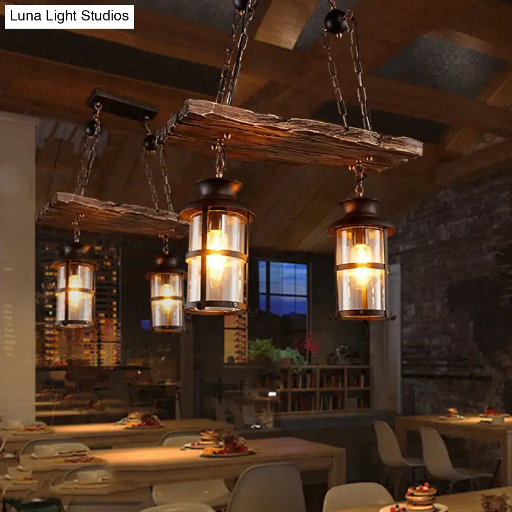 Decorbites industrial pendant light with clear glass lanterns, black metal frames, and wood decoration hanging from beams