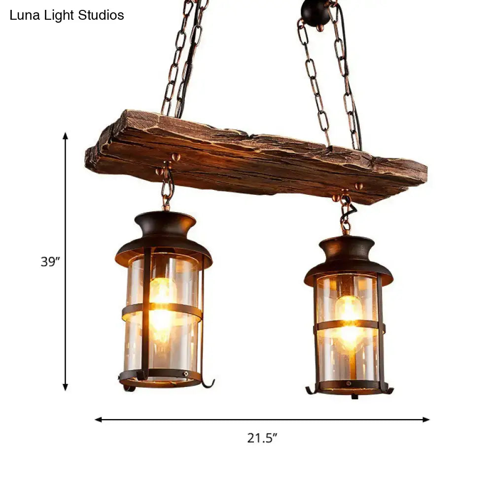 Rustic wooden beam with two black decorbites™ industrial pendant lights featuring clear glass and cage design hanging lamps